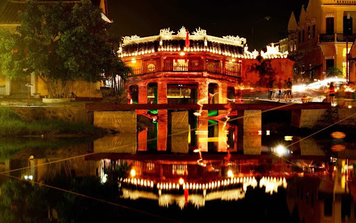A close-up of the Japanese Covered Bridge illuminated at night