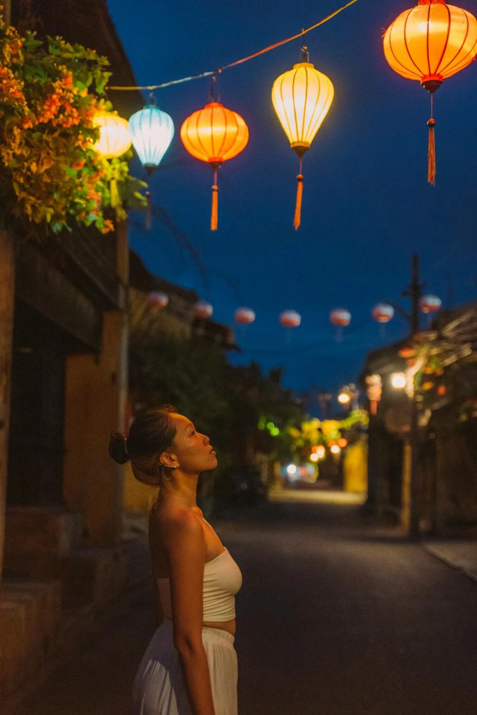 A vibrant shot of Hoi An’s lantern-lit streets at night.