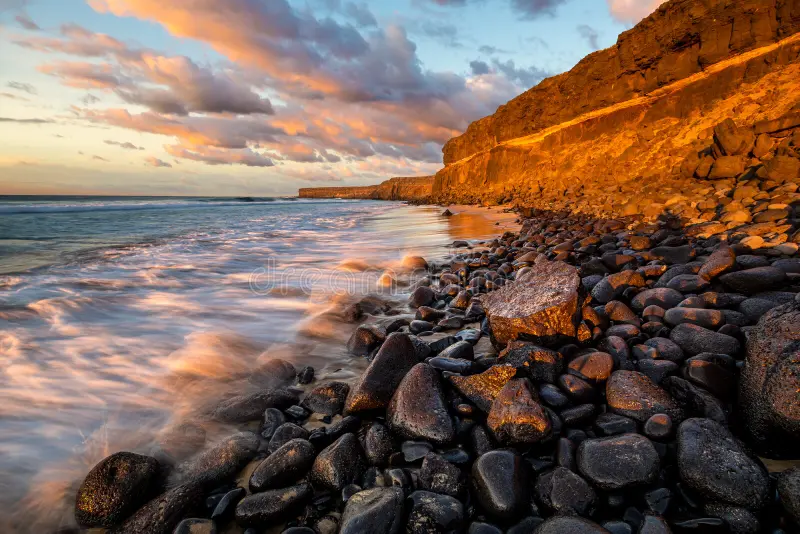 Sunset over rocky coast